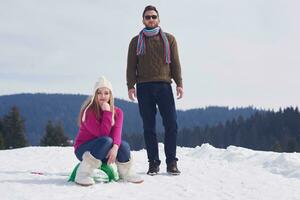 happy young couple having fun on fresh show on winter vacation photo