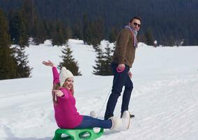 happy young couple having fun on fresh show on winter vacation photo