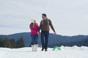 happy young couple having fun on fresh show on winter vacation photo