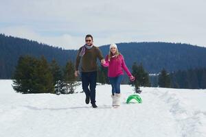 happy young couple having fun on fresh show on winter vacation photo