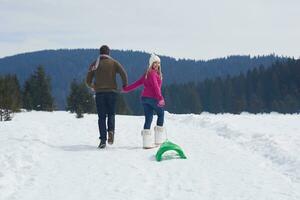 happy young couple having fun on fresh show on winter vacation photo