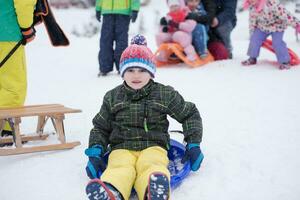 children group  having fun and play together in fresh snow photo