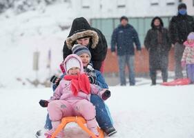 children group  having fun and play together in fresh snow photo