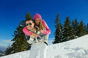 young couple on winter vacation photo