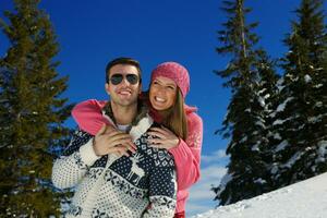 young couple on winter vacation photo