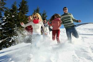 friends have fun at winter on fresh snow photo