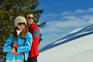 young couple on winter vacation photo