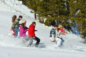 friends have fun at winter on fresh snow photo