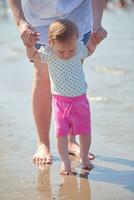 mom and baby on beach  have fun photo