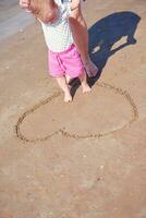 mom and baby on beach  have fun photo