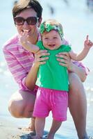 mom and baby on beach  have fun photo