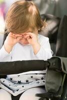 baby girl sitting in the pram photo