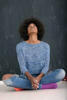 African American woman isolated on a gray background photo