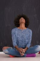 African American woman isolated on a gray background photo