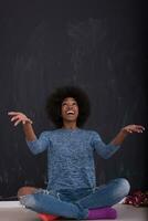 African American woman isolated on a gray background photo