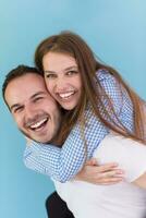 young man piggybacking his girlfriend photo