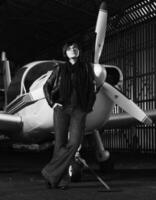 young woman with private airplane photo