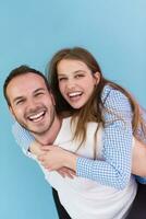 young man piggybacking his girlfriend photo