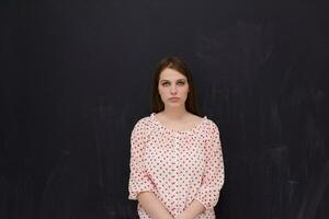 young woman isolated on grey background photo