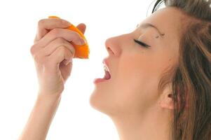 woman isolated on white hold orange photo