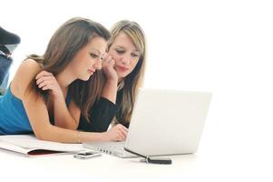 two girl work on laptop photo