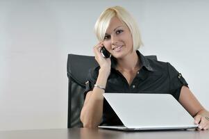 young business woman working in office on laptop photo