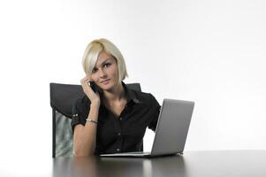 young business woman working in office on laptop photo