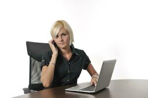 young business woman working in office on laptop photo