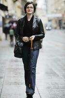 woman on street with umbrella photo