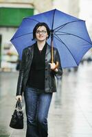 woman on street with umbrella photo