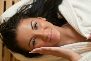 Young woman take a steam bath photo