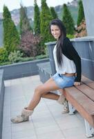 beautiful young lady posing in garden photo