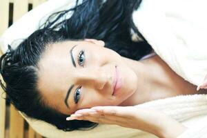 Young woman take a steam bath photo