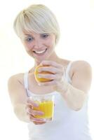 Young woman squeeze orange juice photo