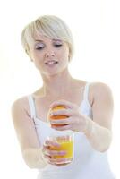 Young woman squeeze orange juice photo