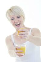 Young woman squeeze orange juice photo