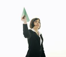 business woman throwing  paper airplane photo