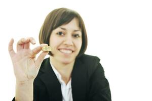 business woman putting coins money in piggy bank photo