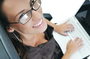 business woman with laptop isolated on white photo