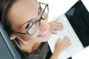 business woman with laptop isolated on white photo