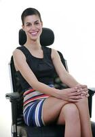 brunette female  model posing on business chair photo