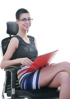 brunette female  model posing on business chair photo