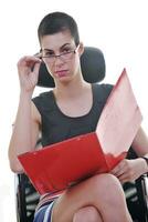 brunette female  model posing on business chair photo