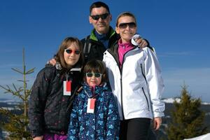 portrait of happy young family at winter photo