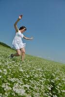 Young happy woman in green field photo