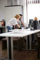 designers in office at the wooden furniture manufacture photo