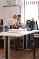 designers in office at the wooden furniture manufacture photo