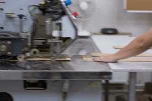 engineer in front of wood cutting machine photo