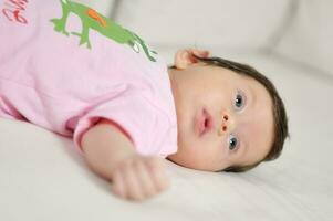 indoor portrait with happy young famil and  cute little babby photo