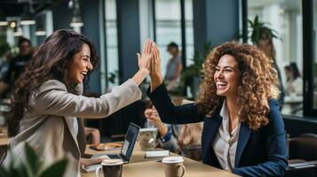 two members of a team are giving each other a high five photo